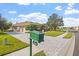 Beautiful single-story home with lush landscaping, a brick driveway, and a well-manicured lawn at 2611 Little Country Rd, Parrish, FL 34219