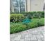 Landscaped yard featuring a sign designating it as 'Yard of the Month' for its curb appeal at 2611 Little Country Rd, Parrish, FL 34219