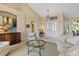 Comfortable living room with a large arched window, neutral tones, and stylish furniture at 2611 Little Country Rd, Parrish, FL 34219