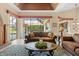 Living room with sliding glass doors leading to a pool and backyard view at 2611 Little Country Rd, Parrish, FL 34219