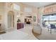 Bright living room with tile floors, vaulted ceiling, and archways to other living areas at 2611 Little Country Rd, Parrish, FL 34219