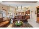 Open living space with a view of the kitchen and dining area, and comfortable seating at 2611 Little Country Rd, Parrish, FL 34219