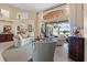 Elegant living room with large windows providing views of the outdoor space and water at 2611 Little Country Rd, Parrish, FL 34219