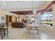 Spacious living area with fireplace and breakfast nook overlooking the water at 2611 Little Country Rd, Parrish, FL 34219