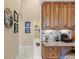 Built-in desk and cabinet space in this home office area at 2611 Little Country Rd, Parrish, FL 34219