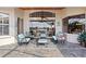 Relaxing patio with an outdoor seating area, a ceiling fan, and a view of the water at 2611 Little Country Rd, Parrish, FL 34219