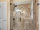 Walk-in shower featuring stylish tile, glass door, and sleek fixtures at 2611 Little Country Rd, Parrish, FL 34219