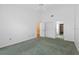 Spacious bedroom with ceiling fan, neutral walls and green carpet flooring at 5343 Huntingwood Ct # 33, Sarasota, FL 34235