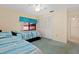 Bedroom featuring two twin beds, fan, closet, and ample natural light at 5343 Huntingwood Ct # 33, Sarasota, FL 34235
