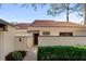 Charming courtyard entrance with gate, lovely landscaping, and visible house number for easy identification at 5343 Huntingwood Ct # 33, Sarasota, FL 34235