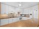 Well-maintained kitchen with white cabinetry, granite countertops, tile backsplash, and modern appliances at 5343 Huntingwood Ct # 33, Sarasota, FL 34235