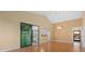 Open floor plan living room showing the kitchen with hardwood floors and lots of natural light at 5343 Huntingwood Ct # 33, Sarasota, FL 34235