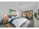 Bright main bedroom with hardwood floors, vaulted ceilings, and a view to the lanai at 5343 Huntingwood Ct # 33, Sarasota, FL 34235