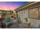 Inviting outdoor patio with seating, decorative accents, and a tranquil ambiance, bathed in the soft light of twilight at 5343 Huntingwood Ct # 33, Sarasota, FL 34235