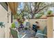 Cozy outdoor patio with comfortable seating, decorative plants, string lights, and a brick-paved ground at 5343 Huntingwood Ct # 33, Sarasota, FL 34235