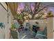 Inviting outdoor patio with comfortable seating and string lights, perfect for relaxing under a vibrant twilight sky at 5343 Huntingwood Ct # 33, Sarasota, FL 34235