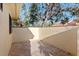 Secluded brick-paved patio enclosed by stucco walls and mature trees for ultimate privacy and relaxation at 5343 Huntingwood Ct # 33, Sarasota, FL 34235