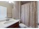 Bathroom featuring a single vanity with a light countertop and a shower-tub combination with a curtain at 6914 45Th E Ter, Bradenton, FL 34203