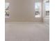 Bright, spacious bedroom with neutral walls and carpet, illuminated by natural light from three windows at 6914 45Th E Ter, Bradenton, FL 34203