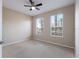 Bedroom showcasing a ceiling fan and bright natural light from two windows at 6914 45Th E Ter, Bradenton, FL 34203