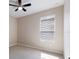 Bedroom showcasing a ceiling fan and bright natural light from the window at 6914 45Th E Ter, Bradenton, FL 34203