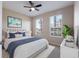 Staged bedroom with large windows, contemporary furniture, and stylish decor at 6914 45Th E Ter, Bradenton, FL 34203