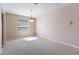 Well-lit room with neutral paint, wall to wall carpet, and a window with blinds, providing a cozy ambiance at 6914 45Th E Ter, Bradenton, FL 34203