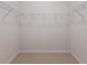 Empty closet with a wire shelving system and carpet flooring at 6914 45Th E Ter, Bradenton, FL 34203