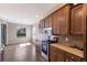 Well lit kitchen featuring stainless steel appliances and tile backsplash at 6914 45Th E Ter, Bradenton, FL 34203