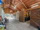 Spacious barn interior with high ceilings, stalls, and ample storage, designed for various uses at 8107 High Oaks Trl, Myakka City, FL 34251