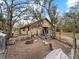 Exterior of the barn with chickens and ducks, in a quaint and rustic setting at 8107 High Oaks Trl, Myakka City, FL 34251