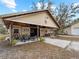 Outdoor barn featuring a porch with outdoor seating, providing a rustic and charming exterior space at 8107 High Oaks Trl, Myakka City, FL 34251