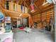 Spacious garage interior with lofted storage, overhead lighting, and ample storage at 8107 High Oaks Trl, Myakka City, FL 34251