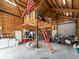 The garage interior features lofted storage, laundry, and workspace at 8107 High Oaks Trl, Myakka City, FL 34251