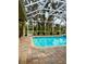 Inviting pool with a screened enclosure offering a relaxing atmosphere and outdoor living at 8107 High Oaks Trl, Myakka City, FL 34251