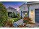 Charming home with well-maintained landscaping, paver walkway, and blue shutters providing an inviting curb appeal at 12810 Seasong Ter, Bradenton, FL 34211