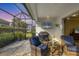 Screened-in patio featuring cozy seating, outdoor television, and relaxing outdoor living space at 12810 Seasong Ter, Bradenton, FL 34211