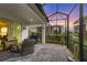 Screened-in patio featuring cozy seating, outdoor television, and relaxing outdoor living space at 12810 Seasong Ter, Bradenton, FL 34211
