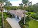 Home with well-kept lawn, tile roof, mature landscaping, and a spacious driveway at 16806 5Th Ne Ter, Bradenton, FL 34212