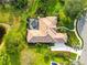 A beautiful property featuring a screened-in pool, lush landscaping, and a meticulously maintained lawn at 16806 5Th Ne Ter, Bradenton, FL 34212