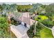 Home with a three-car garage, well-maintained lawn, and beautiful landscaping at 16806 5Th Ne Ter, Bradenton, FL 34212