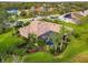 Beautiful home boasts a screened-in pool, well-manicured lawn, and lush landscaping at 16806 5Th Ne Ter, Bradenton, FL 34212