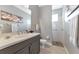 Bathroom features a single sink vanity, neutral tones, and a tiled walk-in shower at 16806 5Th Ne Ter, Bradenton, FL 34212