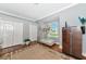 Light filled bedroom with a neutral color scheme, hardwood floors, and two large closets at 16806 5Th Ne Ter, Bradenton, FL 34212