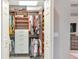 This walk-in closet features custom shelving, cabinets, and plenty of hanging space at 16806 5Th Ne Ter, Bradenton, FL 34212