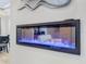 Close up of linear fireplace showing living room and dining room at 16806 5Th Ne Ter, Bradenton, FL 34212