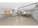 Organized garage space with epoxy flooring and ample storage cabinets for a clutter-free environment at 16806 5Th Ne Ter, Bradenton, FL 34212