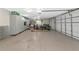 Spacious garage with epoxy flooring, built-in cabinets, and organized storage solutions at 16806 5Th Ne Ter, Bradenton, FL 34212