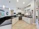 Modern kitchen featuring granite countertops, stainless steel appliances, and ample cabinet space at 16806 5Th Ne Ter, Bradenton, FL 34212