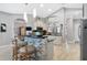The modern kitchen features a breakfast bar with stone accents and pendant lighting at 16806 5Th Ne Ter, Bradenton, FL 34212